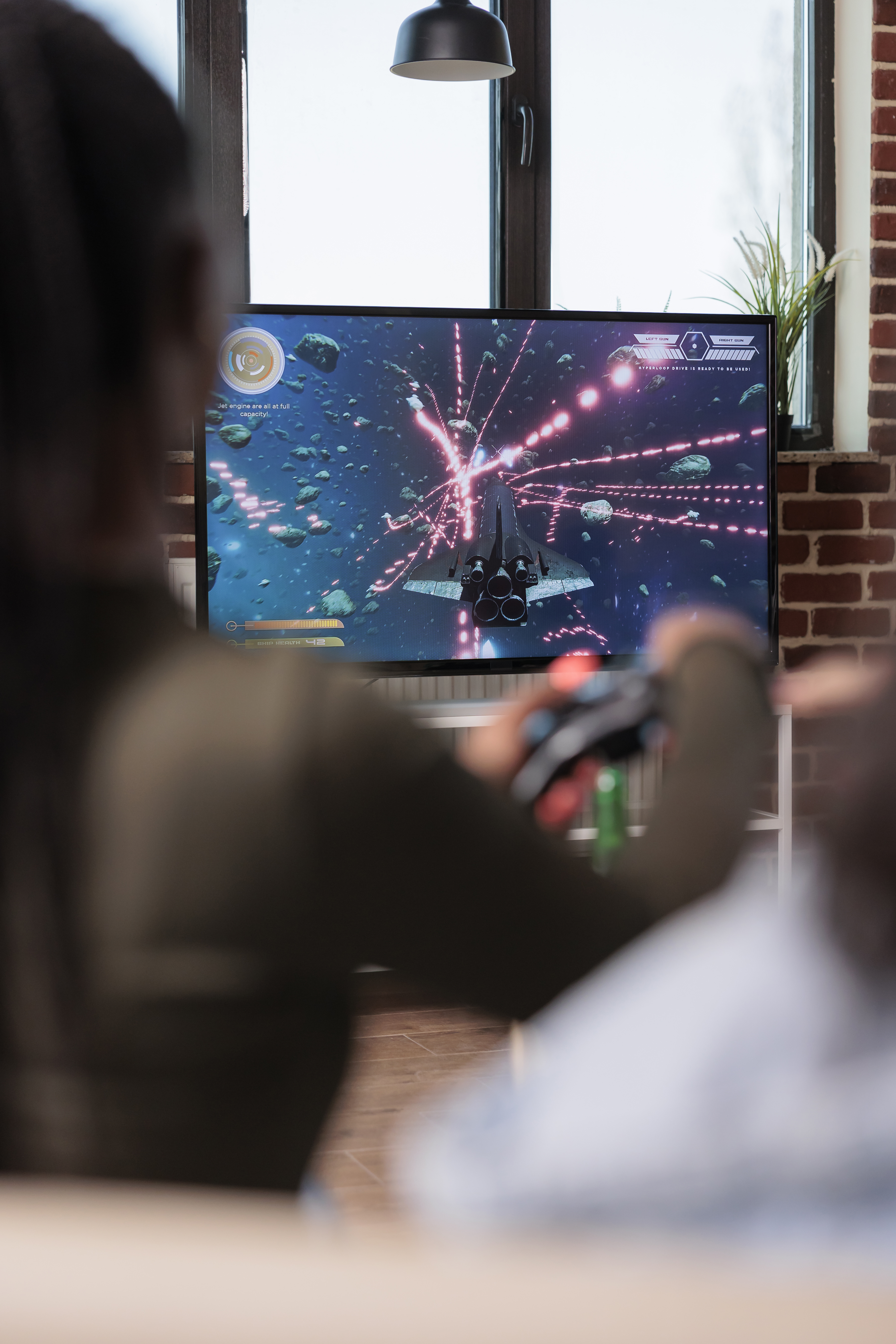 adults-play-video-game-at-home-on-tv-2026-03-19-01-56-22-utc