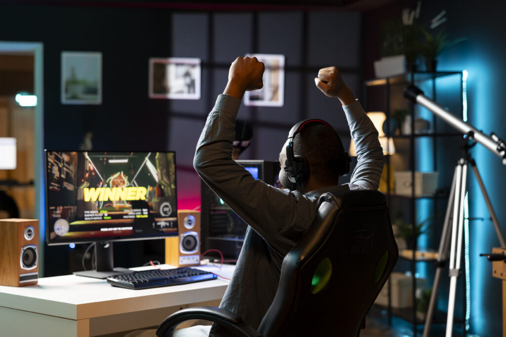 excited-gamer-wins-game-at-computer-desk-2026-03-19-02-06-48-utc