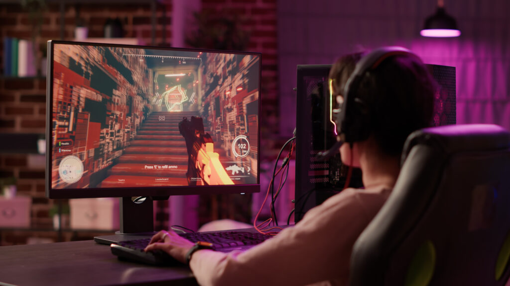 over-shoulder-view-of-gamer-girl-using-pc-gaming-s-2026-03-18-21-58-27-utc