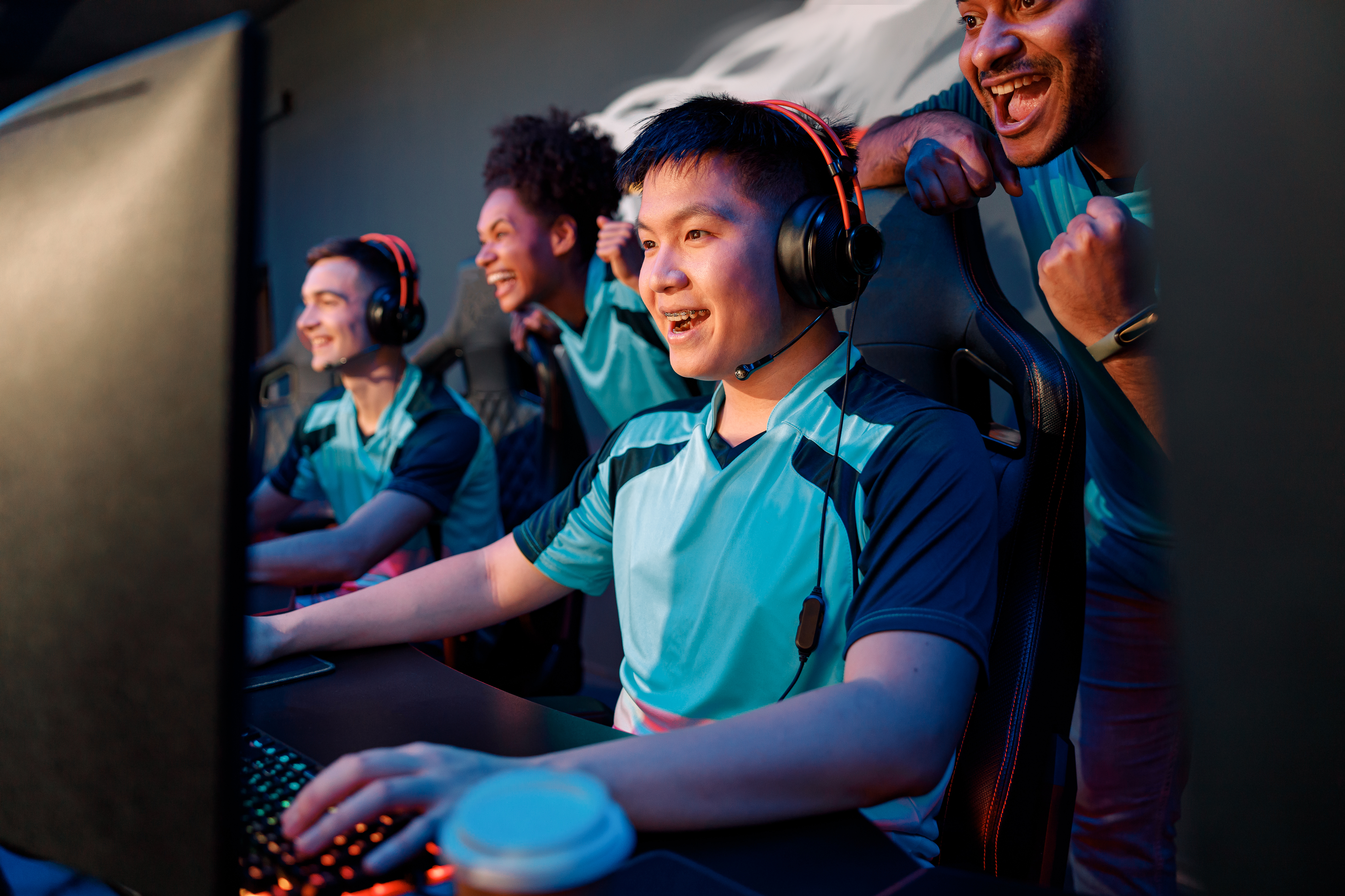 young-asian-man-gaming-with-his-friends-in-cyber-c-2026-03-10-01-09-54-utc